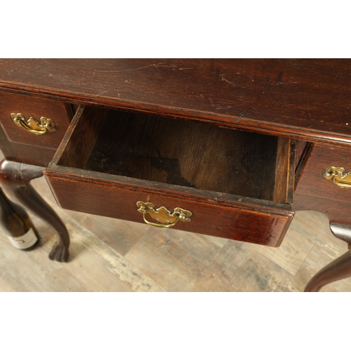 1393 - A GEORGE II OAK LOWBOY with moulded edge top fitted pullout candle side to one side above three frie... 