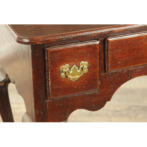 1393 - A GEORGE II OAK LOWBOY with moulded edge top fitted pullout candle side to one side above three frie... 