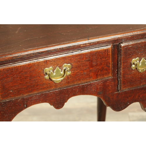 1393 - A GEORGE II OAK LOWBOY with moulded edge top fitted pullout candle side to one side above three frie... 