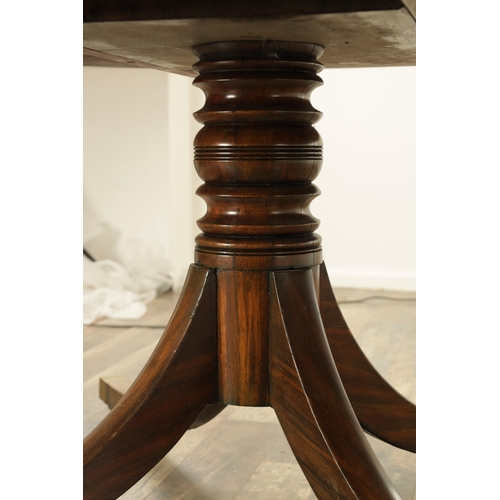 1394 - A LARGE SIX FOOT GEORGE III-STYLE TWELVE SEATER FIGURED ROSEWOOD CIRCULAR DINING TABLE with cross-ba... 