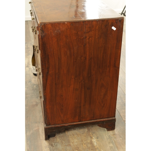 1399 - A GEORGE I FIGURED WALNUT BACHELORS CHEST with quarter veneered cross-banded caddy top above a brush... 