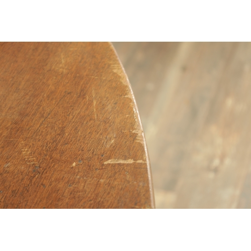 1403 - A GEORGE III MAHOGANY OVAL TILT TOP BREAKFAST TABLE with one piece top raised on a gun barrel stem w... 