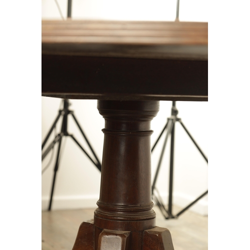 1403 - A GEORGE III MAHOGANY OVAL TILT TOP BREAKFAST TABLE with one piece top raised on a gun barrel stem w... 