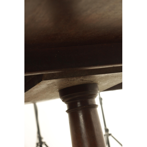 1403 - A GEORGE III MAHOGANY OVAL TILT TOP BREAKFAST TABLE with one piece top raised on a gun barrel stem w... 