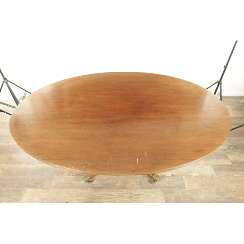 1403 - A GEORGE III MAHOGANY OVAL TILT TOP BREAKFAST TABLE with one piece top raised on a gun barrel stem w... 