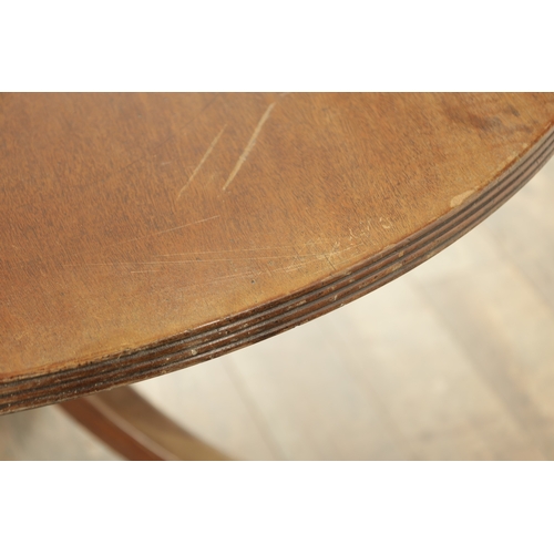 1403 - A GEORGE III MAHOGANY OVAL TILT TOP BREAKFAST TABLE with one piece top raised on a gun barrel stem w... 