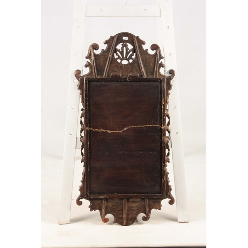 1409 - A PAIR OF GEORGE II WALNUT AND GILTWOOD HANGING MIRRORS with leaf work crests and floral decorated s... 