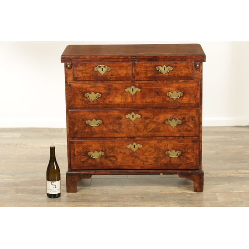 1415 - AN EARLY 18TH CENTURY FIGURED WALNUT AND HERRING BANDED BACHELORS CHEST with fold-over hinged top ab... 