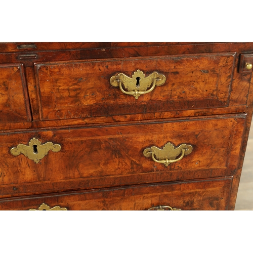 1415 - AN EARLY 18TH CENTURY FIGURED WALNUT AND HERRING BANDED BACHELORS CHEST with fold-over hinged top ab... 