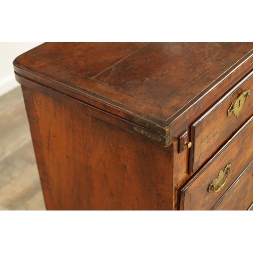 1415 - AN EARLY 18TH CENTURY FIGURED WALNUT AND HERRING BANDED BACHELORS CHEST with fold-over hinged top ab... 