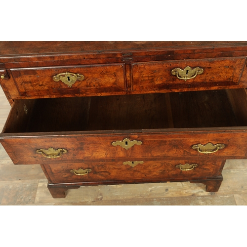 1415 - AN EARLY 18TH CENTURY FIGURED WALNUT AND HERRING BANDED BACHELORS CHEST with fold-over hinged top ab... 