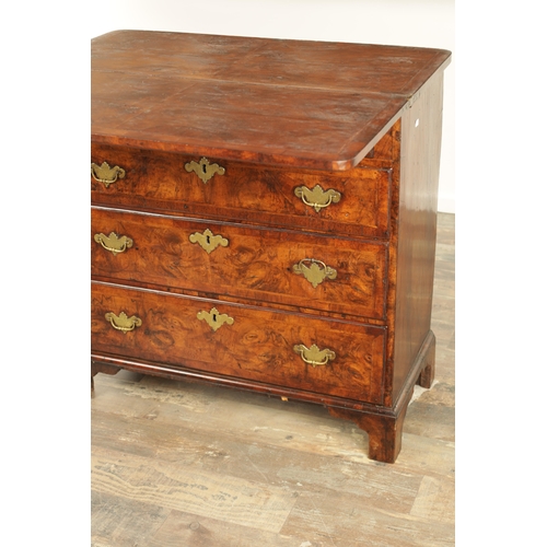 1415 - AN EARLY 18TH CENTURY FIGURED WALNUT AND HERRING BANDED BACHELORS CHEST with fold-over hinged top ab... 