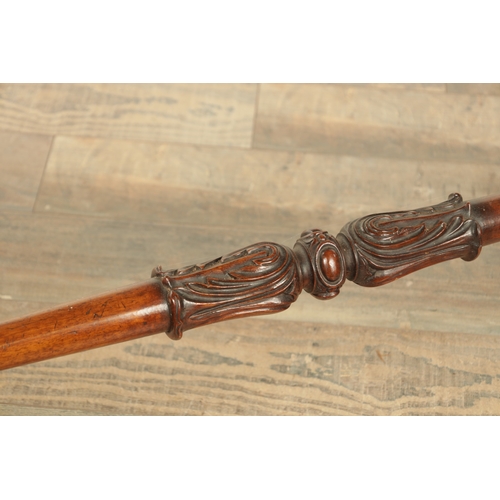 1416 - A VICTORIAN BURR WALNUT SERPENTINE SHAPED LIBRARY TABLE with moulded edge top above leaf carved end ... 