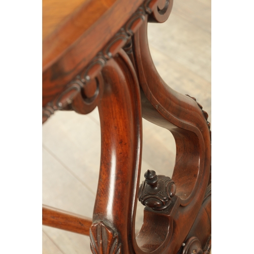 1416 - A VICTORIAN BURR WALNUT SERPENTINE SHAPED LIBRARY TABLE with moulded edge top above leaf carved end ... 