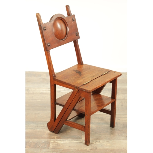 1420 - AN ARTS AND CRAFTS WALNUT METAMORPHIC LIBRARY CHAIR / STEPS with roundel shaped back above a hinged ... 