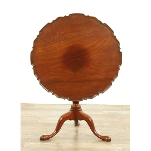 1422 - A GEORGE III MAHOGANY TILT-TOP TABLE with one piece pie crust top above a tapering stem with cabriol... 