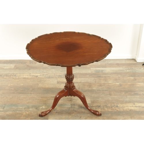 1422 - A GEORGE III MAHOGANY TILT-TOP TABLE with one piece pie crust top above a tapering stem with cabriol... 