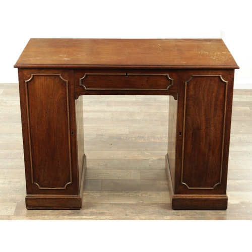 1423 - A GEORGE III MAHOGANY KNEEHOLE DESK with panelled central drawer and hinged sides revealing banks of... 