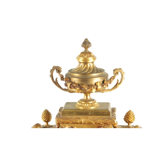 969 - A LATE 19TH CENTURY FRENCH ORMOLU MANTEL CLOCK with large urn and swag finial above column case with... 