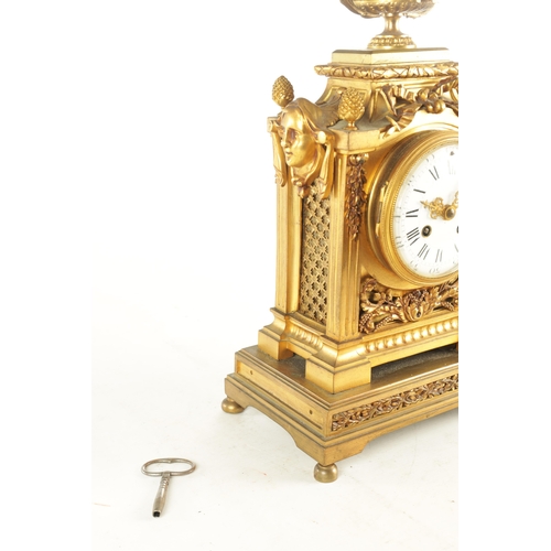 969 - A LATE 19TH CENTURY FRENCH ORMOLU MANTEL CLOCK with large urn and swag finial above column case with... 