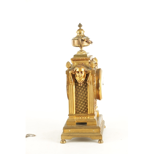 969 - A LATE 19TH CENTURY FRENCH ORMOLU MANTEL CLOCK with large urn and swag finial above column case with... 