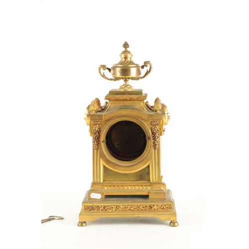 969 - A LATE 19TH CENTURY FRENCH ORMOLU MANTEL CLOCK with large urn and swag finial above column case with... 