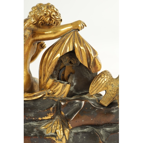 970 - A REGENCY ENGLISH BRONZE AND GILT BRONZE SMALL MANTEL CLOCK modelled with a cherub laying in a natur... 