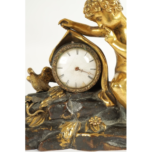 970 - A REGENCY ENGLISH BRONZE AND GILT BRONZE SMALL MANTEL CLOCK modelled with a cherub laying in a natur... 