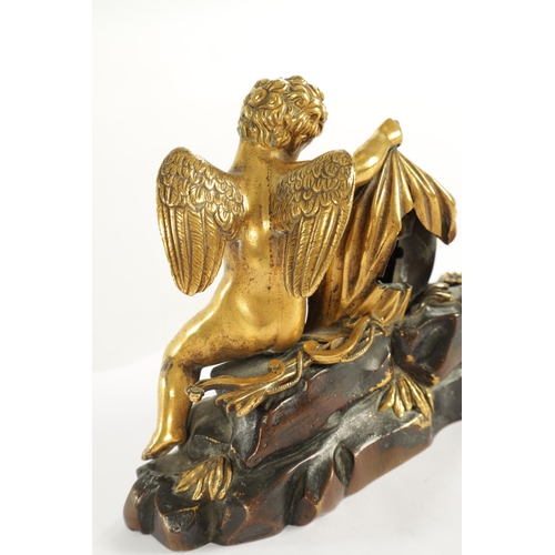 970 - A REGENCY ENGLISH BRONZE AND GILT BRONZE SMALL MANTEL CLOCK modelled with a cherub laying in a natur... 