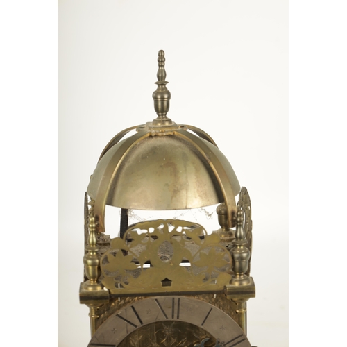 971 - A BRASS WEIGHT DRIVEN LANTERN CLOCK with a silvered chapter ring and 30-hour movement striking on a ... 