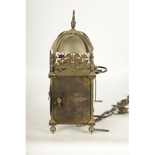 971 - A BRASS WEIGHT DRIVEN LANTERN CLOCK with a silvered chapter ring and 30-hour movement striking on a ... 