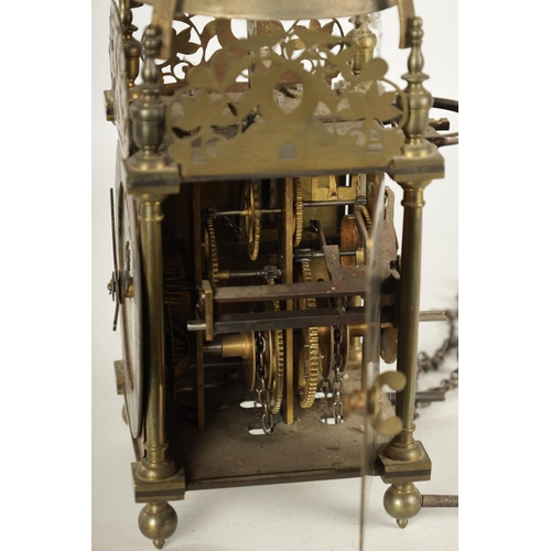 971 - A BRASS WEIGHT DRIVEN LANTERN CLOCK with a silvered chapter ring and 30-hour movement striking on a ... 