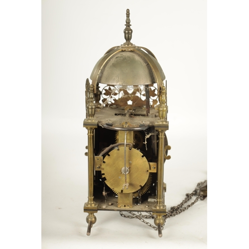 971 - A BRASS WEIGHT DRIVEN LANTERN CLOCK with a silvered chapter ring and 30-hour movement striking on a ... 