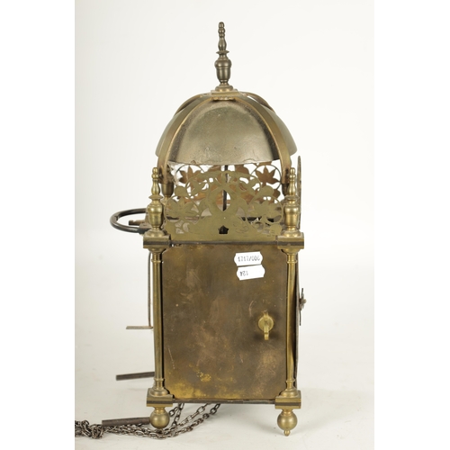 971 - A BRASS WEIGHT DRIVEN LANTERN CLOCK with a silvered chapter ring and 30-hour movement striking on a ... 