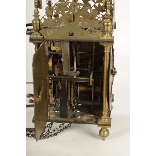 971 - A BRASS WEIGHT DRIVEN LANTERN CLOCK with a silvered chapter ring and 30-hour movement striking on a ... 