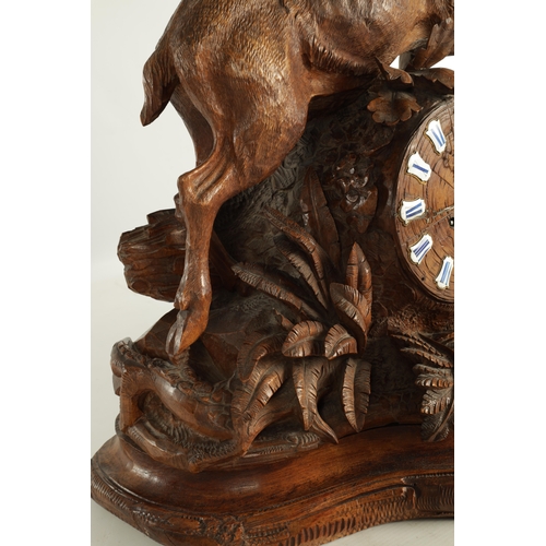 975 - A LARGE 19TH CENTURY CARVED LINDEN WOOD BLACK FOREST MANTEL CLOCK modelled as a stag amongst foliage... 