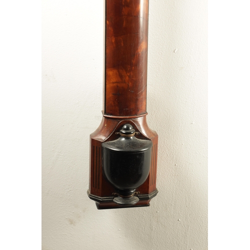 985 - A GEORGIAN STYLE FIGURED MAHOGANY BOW FRONTED STICK BAROMETER, having a swan neck pediment above a c... 