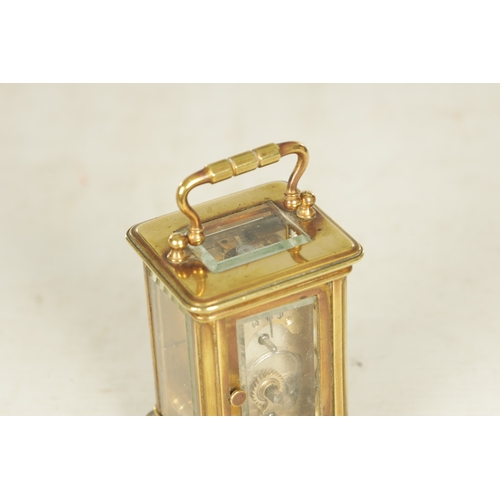 993 - A LATE 19TH CENTURY FRENCH BRASS MINIATURE CARRIAGE CLOCK the Corniche case enclosing an inscribed s... 