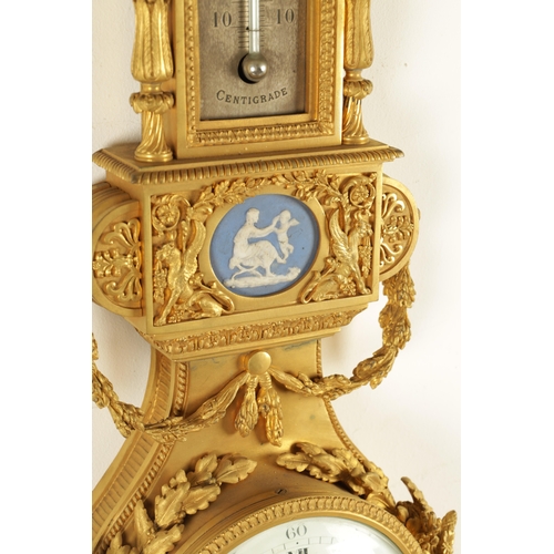 997 - A FINE MATCHED PAIR OF 19TH CENTURY FRENCH GILT BRONZE AND WEDGWOOD PANELLED HANGING WHEEL BAROMETER... 