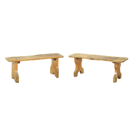 1240 - A PAIR OF 20TH CENTURY OAK BENCHES with shaped plank tops and end supports. (123cm wide 46cm high )