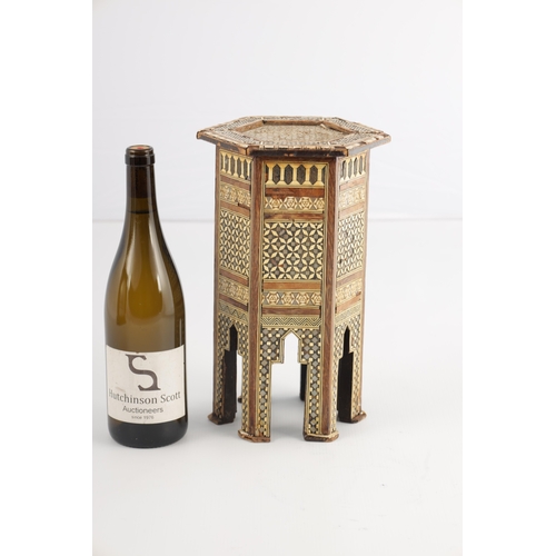 256 - A 19TH CENTURY MINIATURE ISLAMIC INLAID BONE AND MOTHER OF PEARL TABLE having a hexagonal shaped top... 