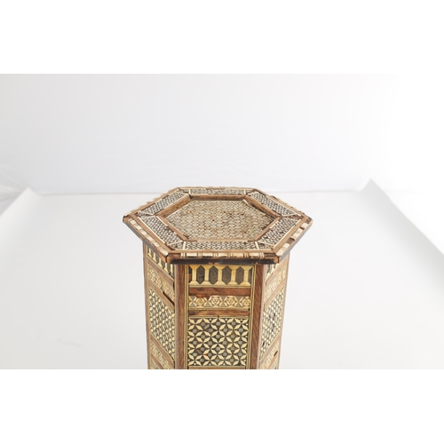 256 - A 19TH CENTURY MINIATURE ISLAMIC INLAID BONE AND MOTHER OF PEARL TABLE having a hexagonal shaped top... 