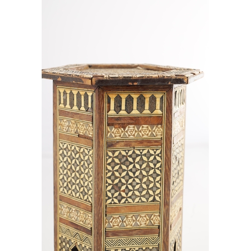 256 - A 19TH CENTURY MINIATURE ISLAMIC INLAID BONE AND MOTHER OF PEARL TABLE having a hexagonal shaped top... 