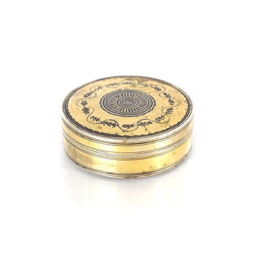 105 - AN EARLY 19TH CENTURY FRENCH SILVER GILT CIRCULAR SNUFF BOX with engraved floral decoration - hallma... 
