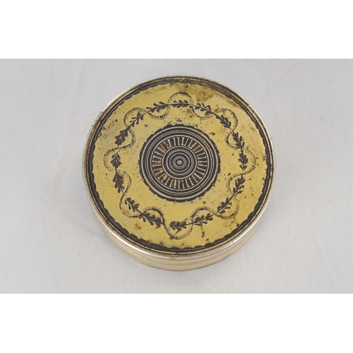 105 - AN EARLY 19TH CENTURY FRENCH SILVER GILT CIRCULAR SNUFF BOX with engraved floral decoration - hallma... 