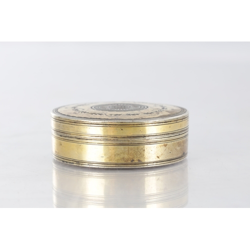 105 - AN EARLY 19TH CENTURY FRENCH SILVER GILT CIRCULAR SNUFF BOX with engraved floral decoration - hallma... 