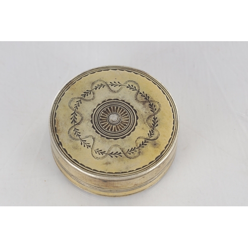 105 - AN EARLY 19TH CENTURY FRENCH SILVER GILT CIRCULAR SNUFF BOX with engraved floral decoration - hallma... 