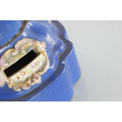 67 - A 19TH CENTURY MEISSEN FLOWER VASE on a blue ground with rococo style panels of flower sprays - pain... 