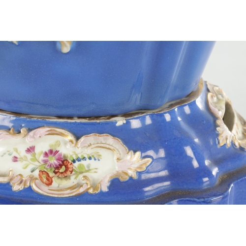 67 - A 19TH CENTURY MEISSEN FLOWER VASE on a blue ground with rococo style panels of flower sprays - pain... 
