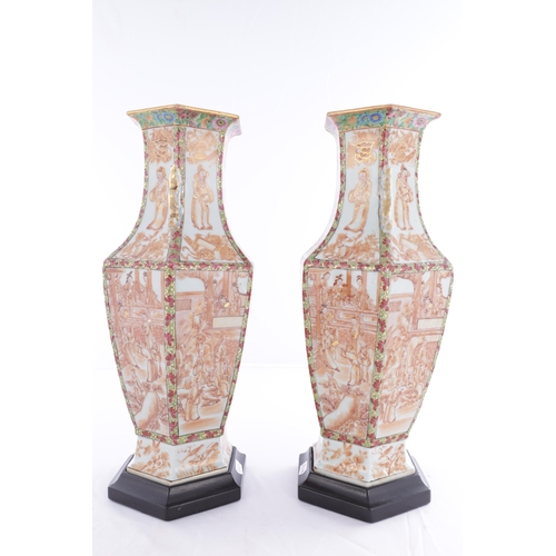 86 - A PAIR OF 18TH CENTURY CANTONESE CHINESE VASES of hexagonal form with shaped side handles, decorated... 